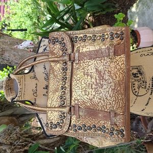 Tre Vero distressed gold leather studded satchel bag. Gently worn